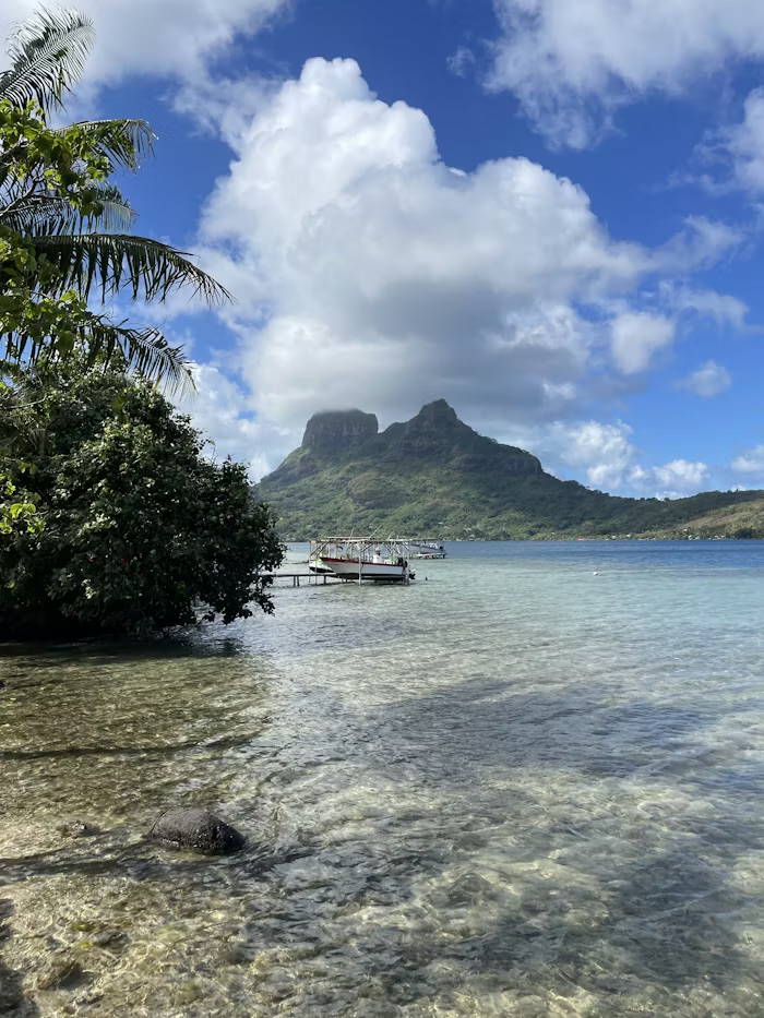 Lush volcanic mountains and turquoise lagoon of Tahiti, French Polynesia